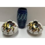 A Royal Doulton vase with a blue ground D5939 together with a pair of Shelley squat vases