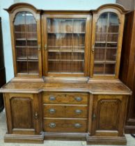 A 20th century walnut sideboard with a double glazed domed top,