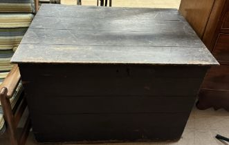 A large pine coffer with a planked top and front
