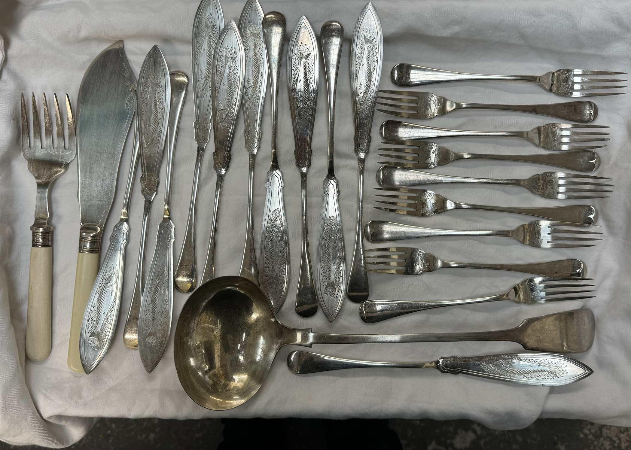 An Electroplated ladle together with assorted electroplated flatwares