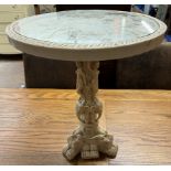 A faux ivory occasional table decorated with figures in a carriage,