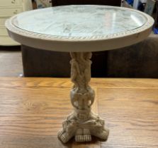 A faux ivory occasional table decorated with figures in a carriage,