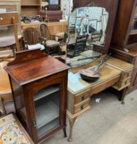 A 20th century walnut dressing table together with a mahogany music cabinet and a copper bedwarming