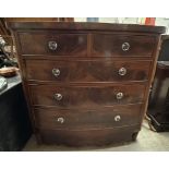 A 19th century mahogany chest with a D shaped top above two short and three long graduated drawers