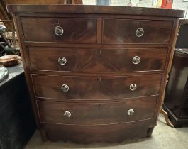 A 19th century mahogany chest with a D shaped top above two short and three long graduated drawers