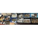 A large collection of hand painted and unpainted model soldiers with guns, pikes, flags,