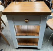 A cream painted pine butchers block,