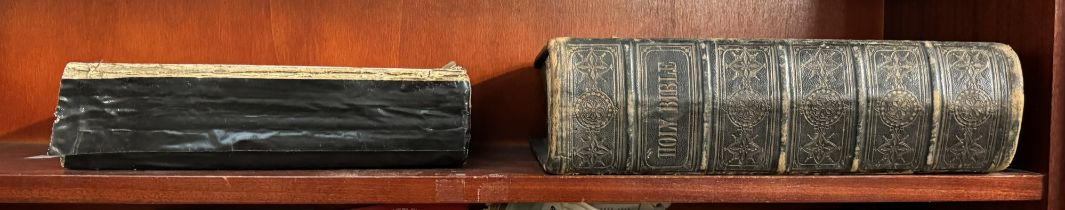 A leather bound Bible together with another Bible