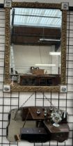 A gilt framed wall mirror of rectangular form with porcelain panels inset together with another