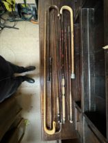A Little Gem split cane rod together with two other rods and walking sticks