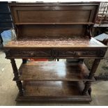 A 19th century oak low countries buffet with a hinged rectangular top enclosing a marble top and