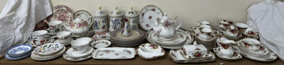 A Royal Albert Old Country Roses pattern part tea service together with Dunoon pottery storage jars
