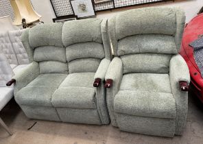 An upholstered two seater settee and matching armchair