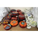 A collection of Poole pottery trinket boxes and covers of circular form patterns including Poppy