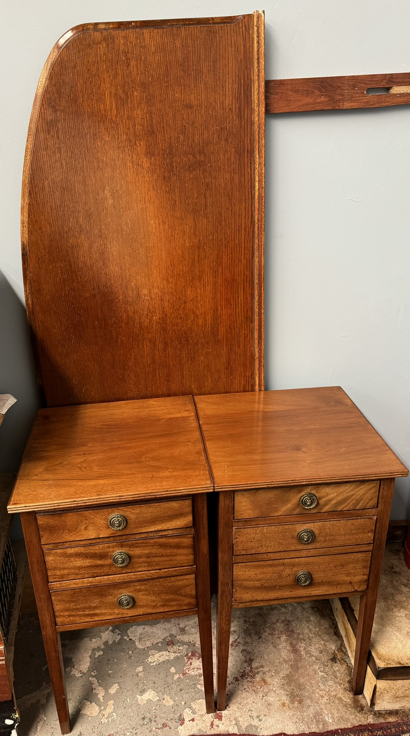 A pair of 19th century mahogany bedside cabinets together with an oak headboard