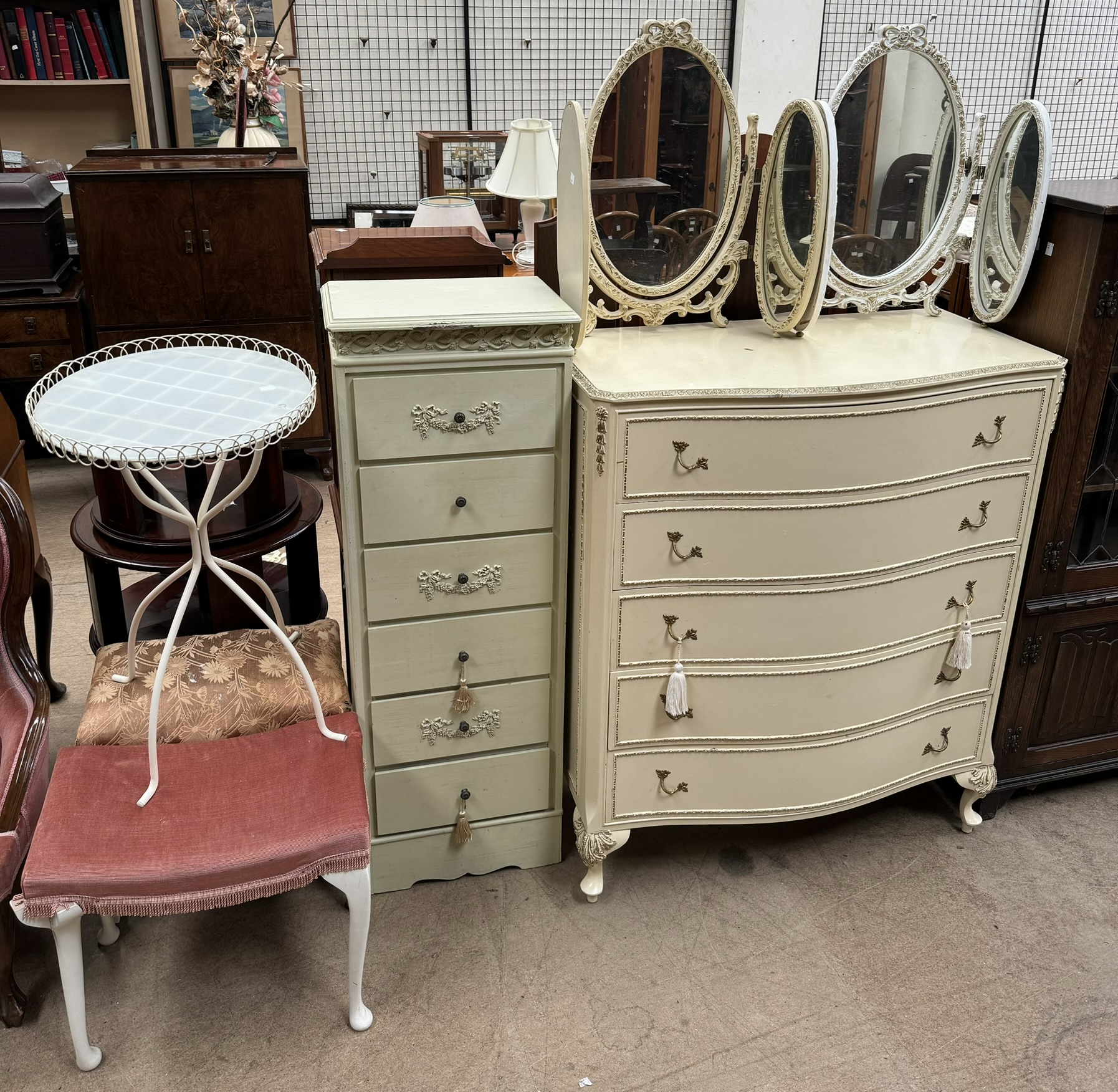 A cream painted five drawer chest together with a tall painted chest of drawers two triptych