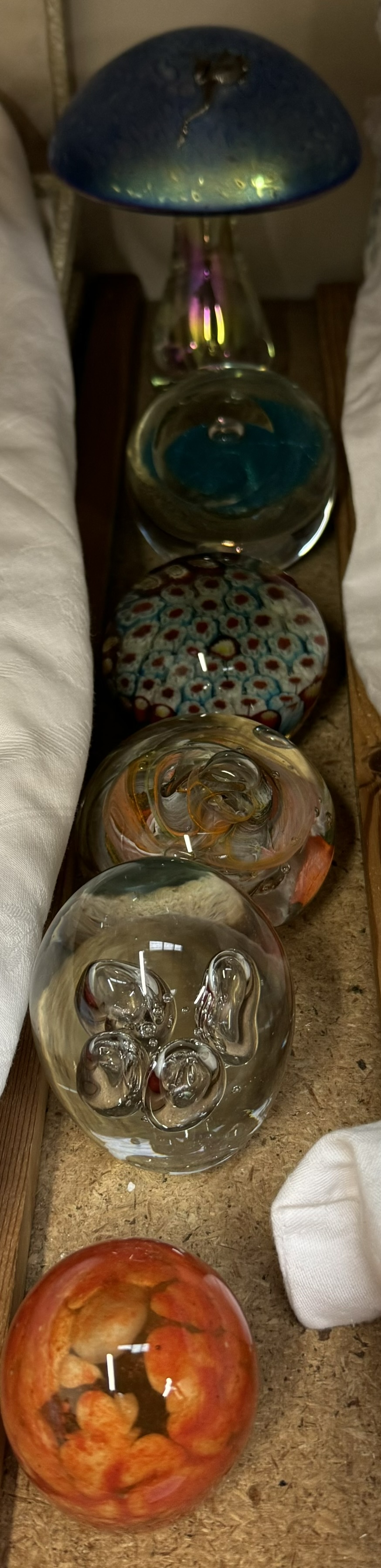 A collection of Glass paperweights including Caithness and a glass mushroom