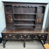 A 19th century and later dresser, the rack with a moulded cornice, cupboards and rack,