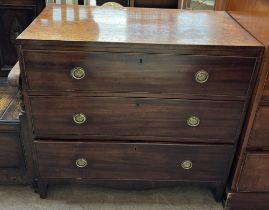 A 19th century mahogany chest with three long drawers on bracket feet