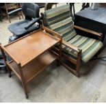 A mid 20th century teak rocking chair together with a teak drinks trolley CONDITION