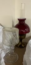 A cut glass table lamp and shade together with a brass and glass oil lamp