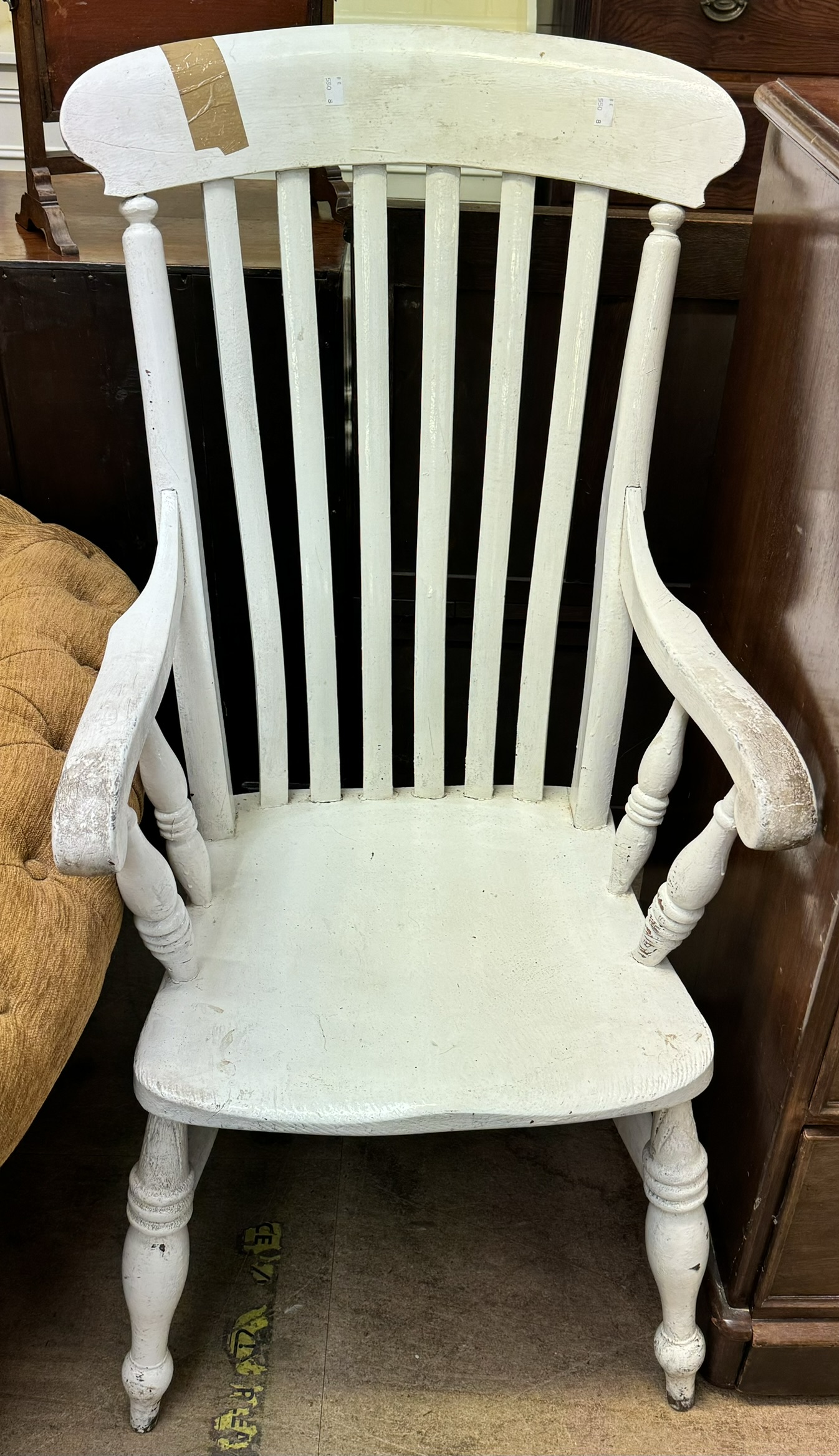 A white painted kitchen slat back chair