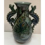 A G H Brannam twin dragon handled vase with incised fish decoration, inscribed to the base, 21.