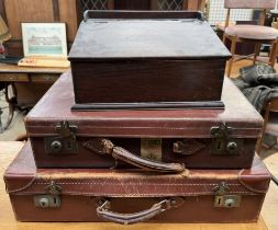 Two leather suitcases together with an oak table top desk