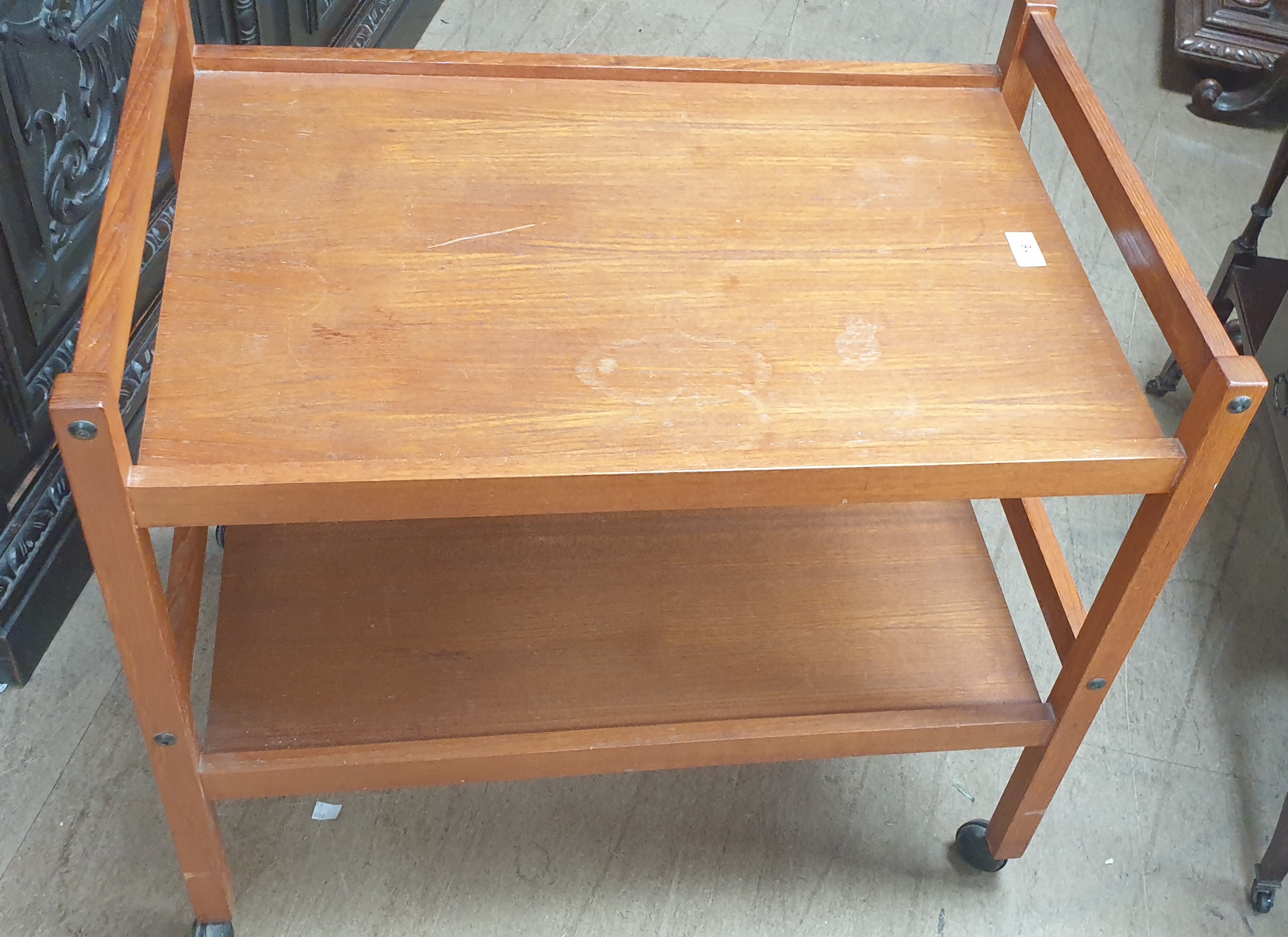 A mid 20th century teak rocking chair together with a teak drinks trolley CONDITION - Image 12 of 12