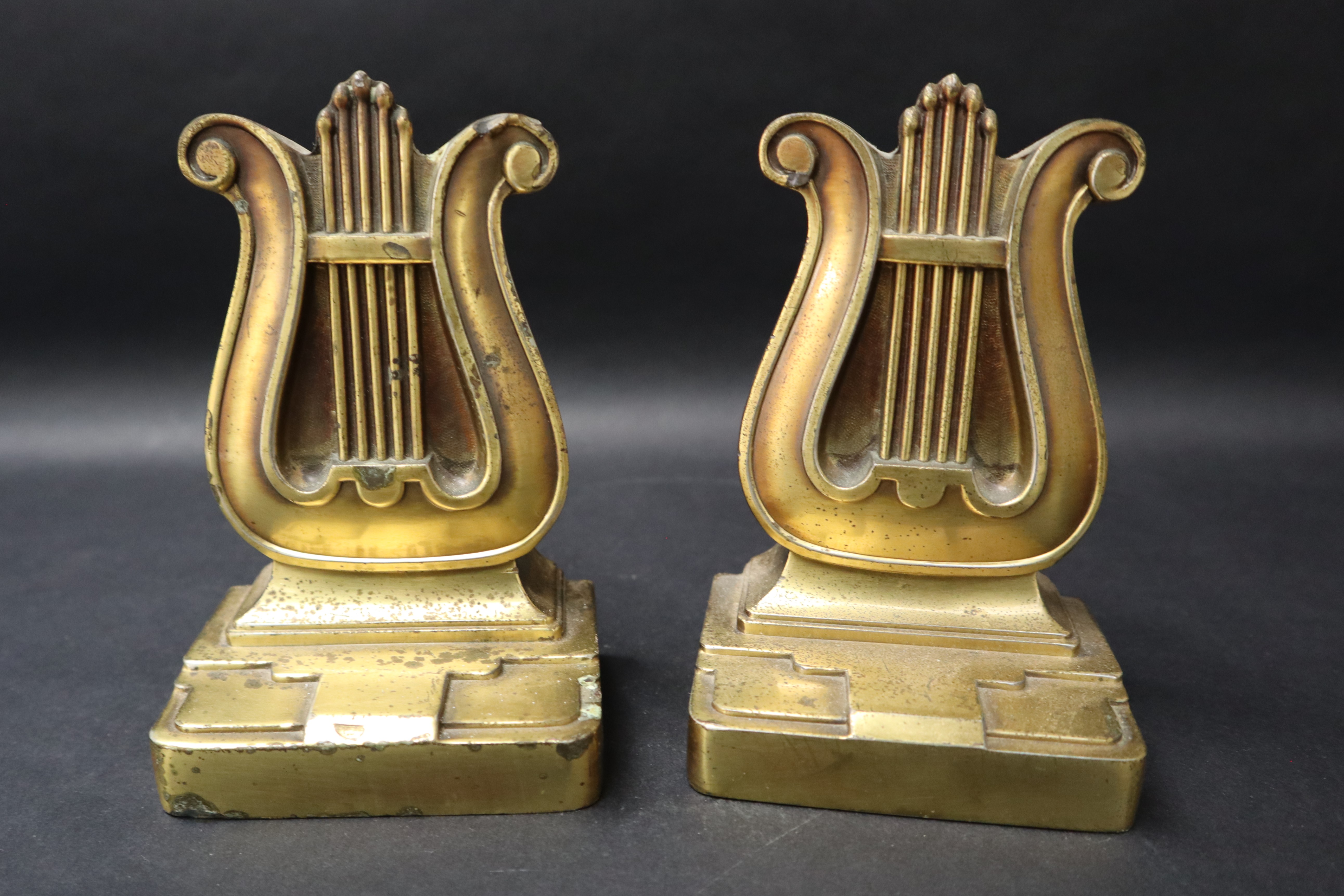 A pair of bronze book ends in the form of lyres on a rectangular base, moulded 56B PMC, - Image 5 of 6