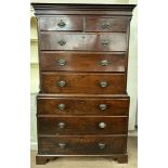 An 18th century oak chest on chest with a moulded cornice above two short and six long graduated