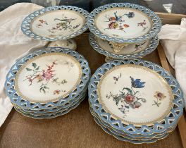A Limoges dessert set with a basket weave border decorated to the centre with flowers and leaves