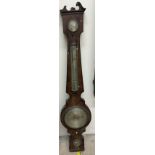 A 19th century mahogany barometer with a broken swan neck pediment, hydrometer, mercury thermometer,