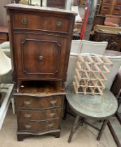 A mahogany chest of drawers with a serpentine top together with another mahogany side cabinet,