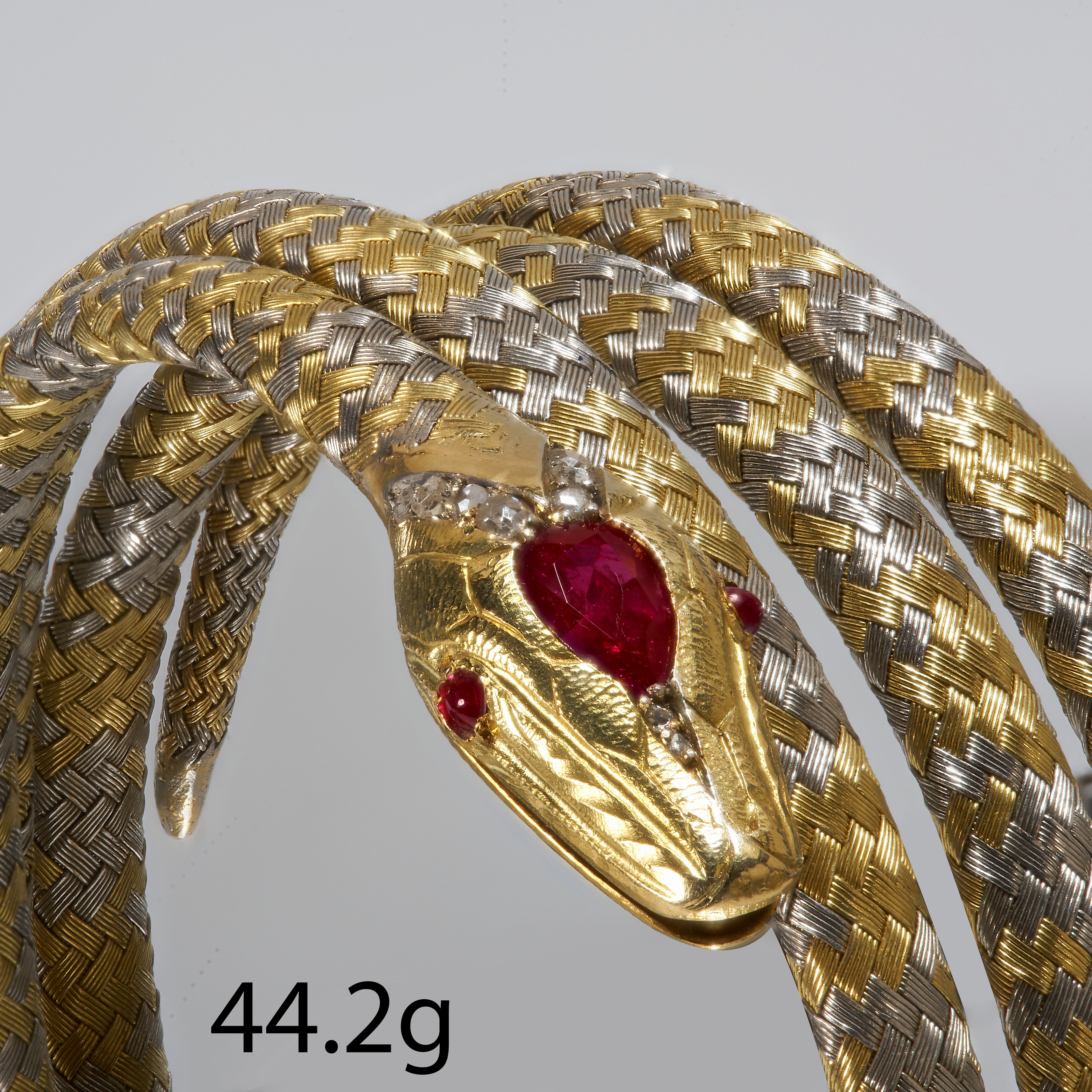 UNUSUAL BI-COLOR RUBY AND DIAMOND COILED SNAKE BANGLE