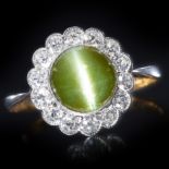 AN EDWARDIAN CHRYSOBERYL CATS EYE AND DIAMOND RING