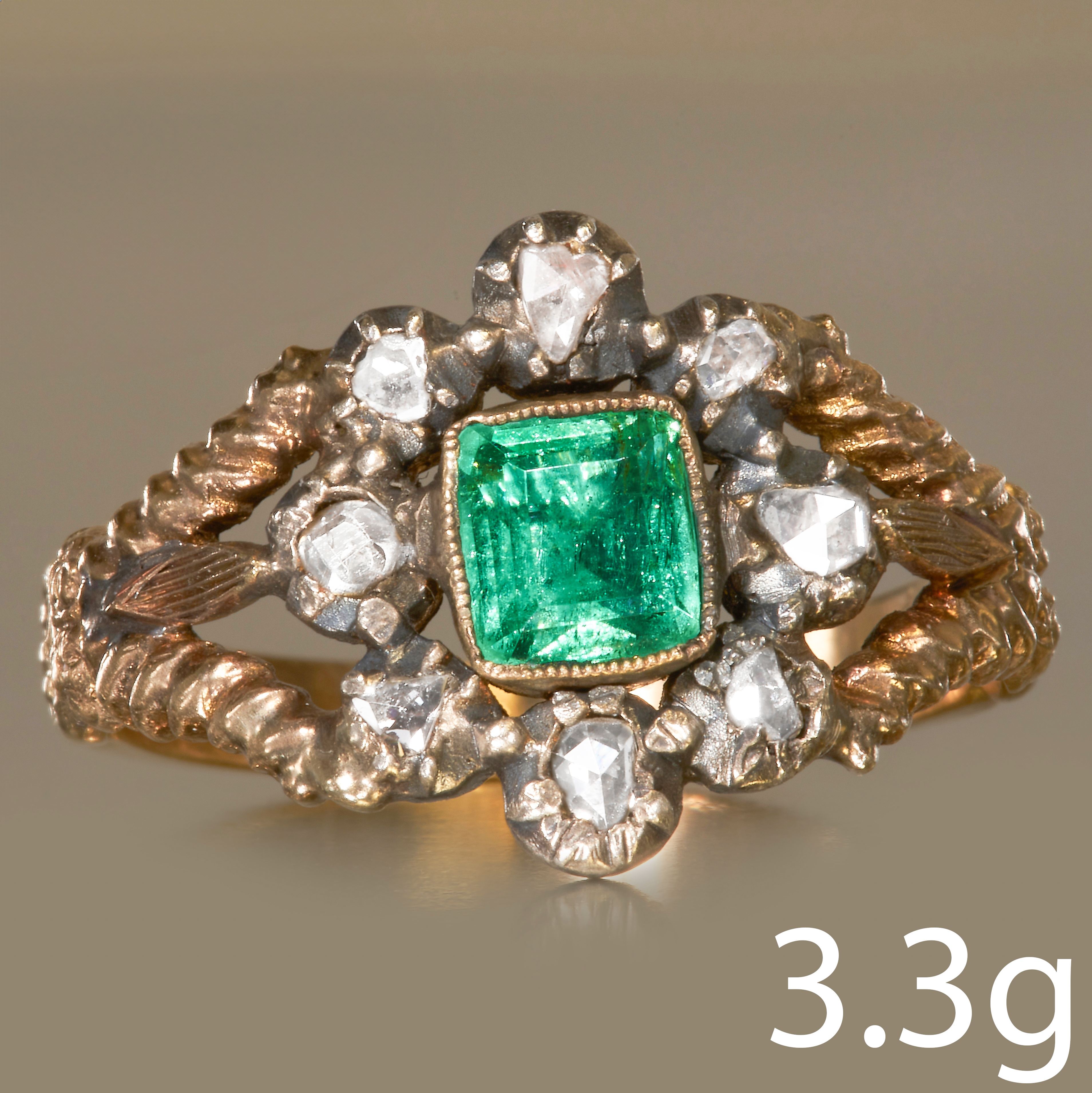 ANTIQUE EMERALD AND DIAMOND CLUSTER RING