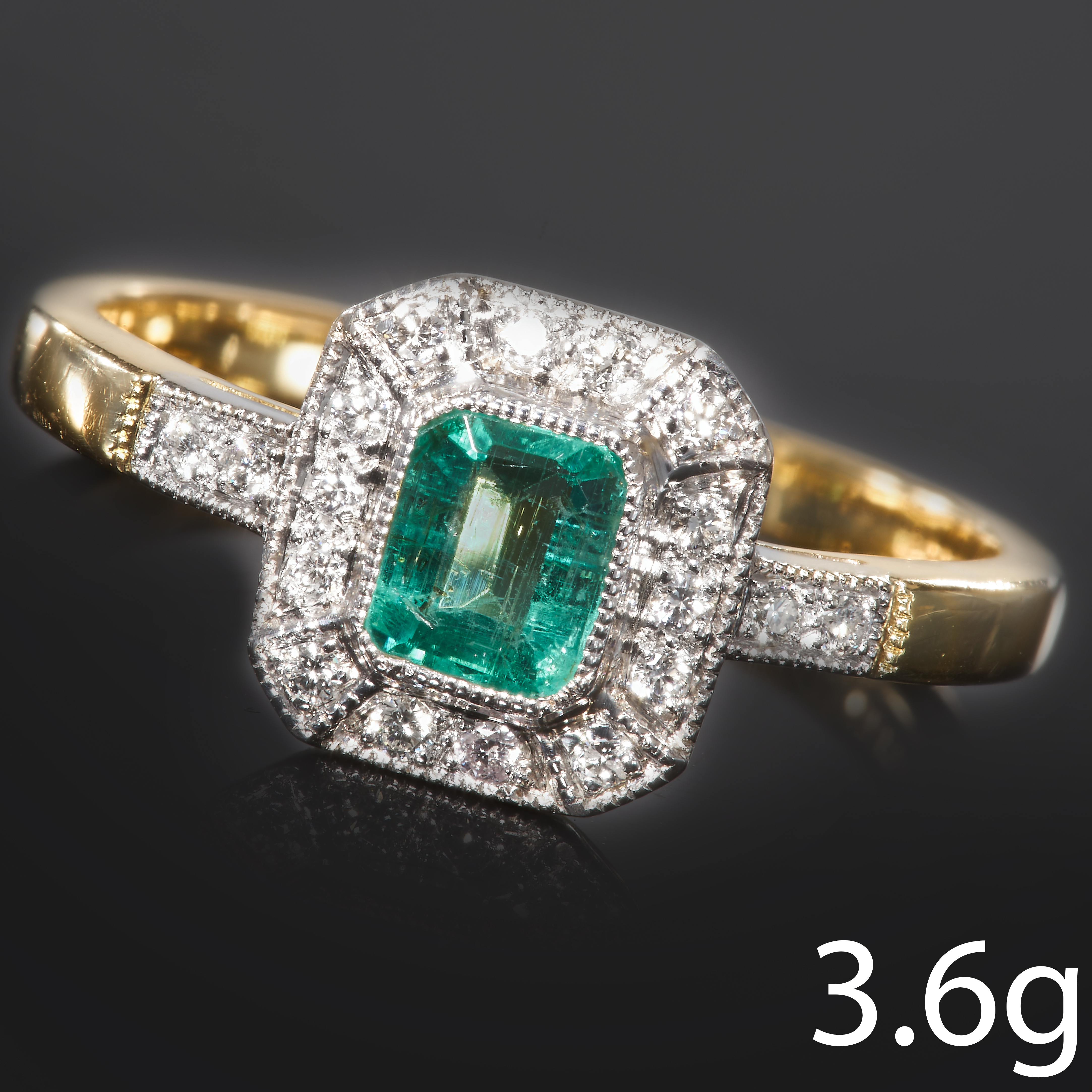 EMERALD AND DIAMOND CLUSTER RING