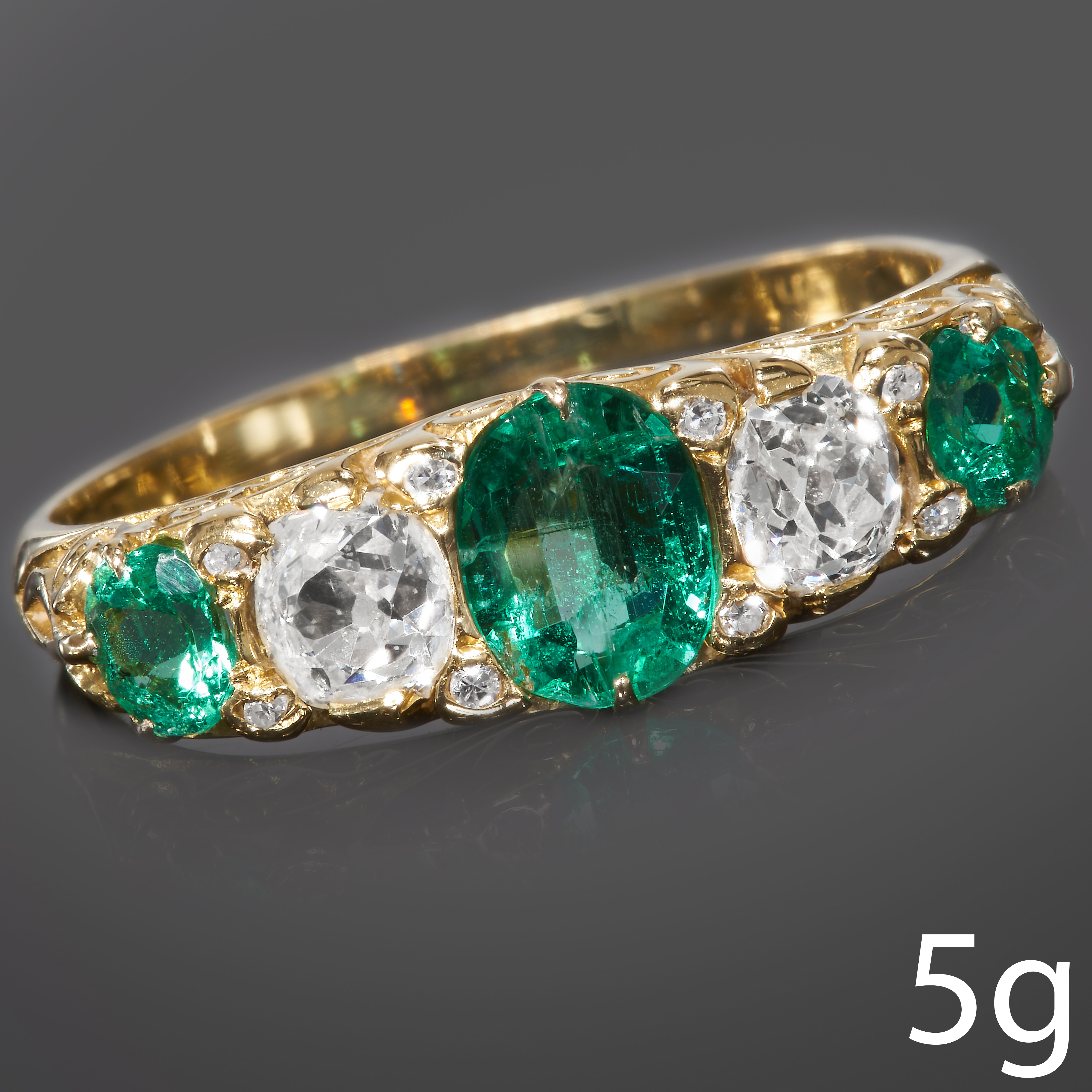 EMERALD AND DIAMOND 5-STONE RING