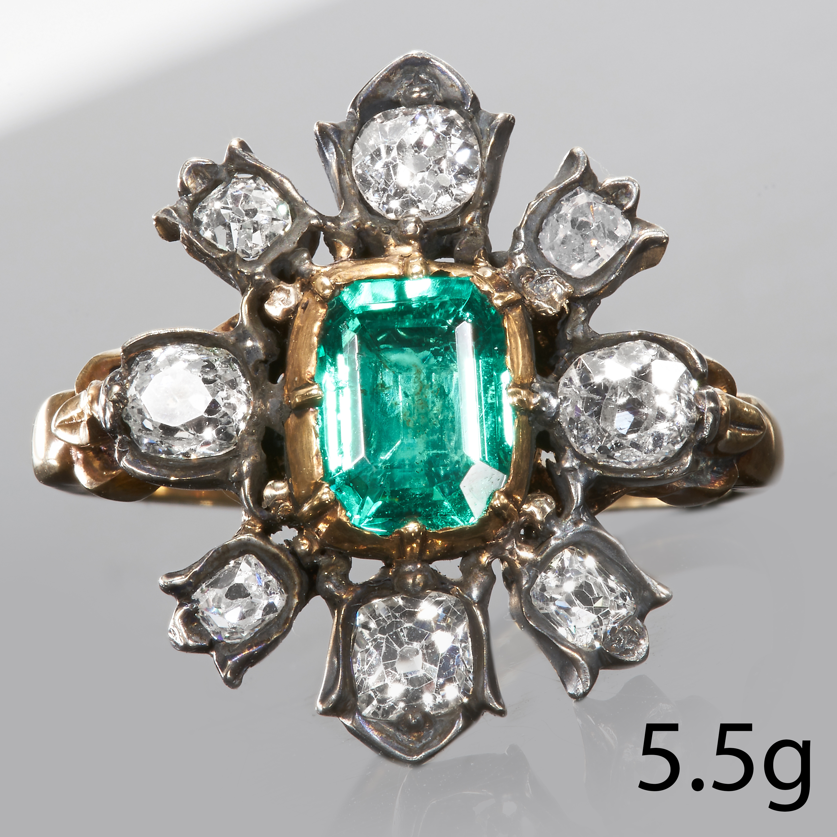 ANTIQUE EMERALD AND DIAMOND CLUSTER RING