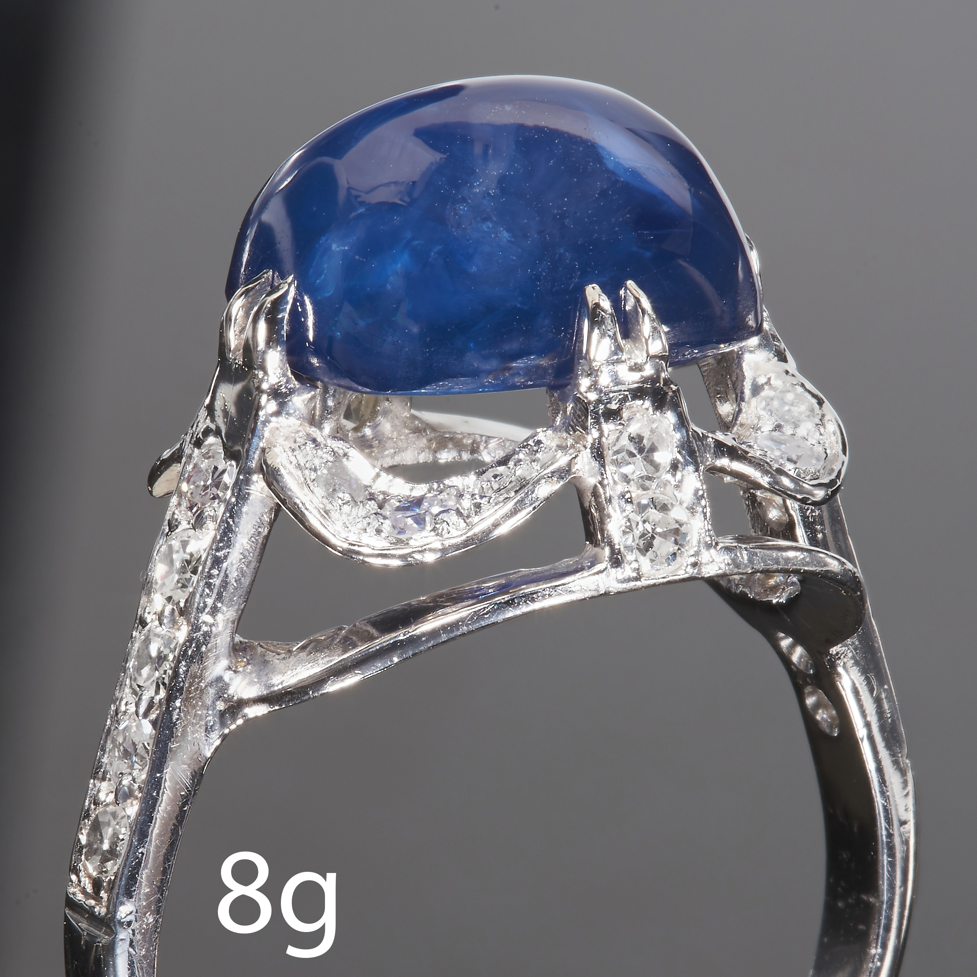 ART-DECO SUGAR LOAF SAPPHIRE AND DIAMOND CLUSTER RING