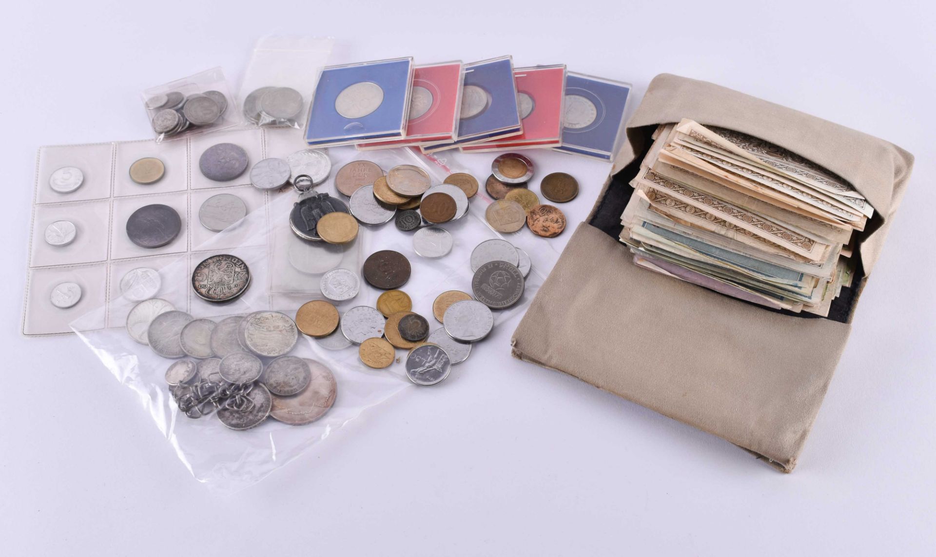 A group of coins and banknotes