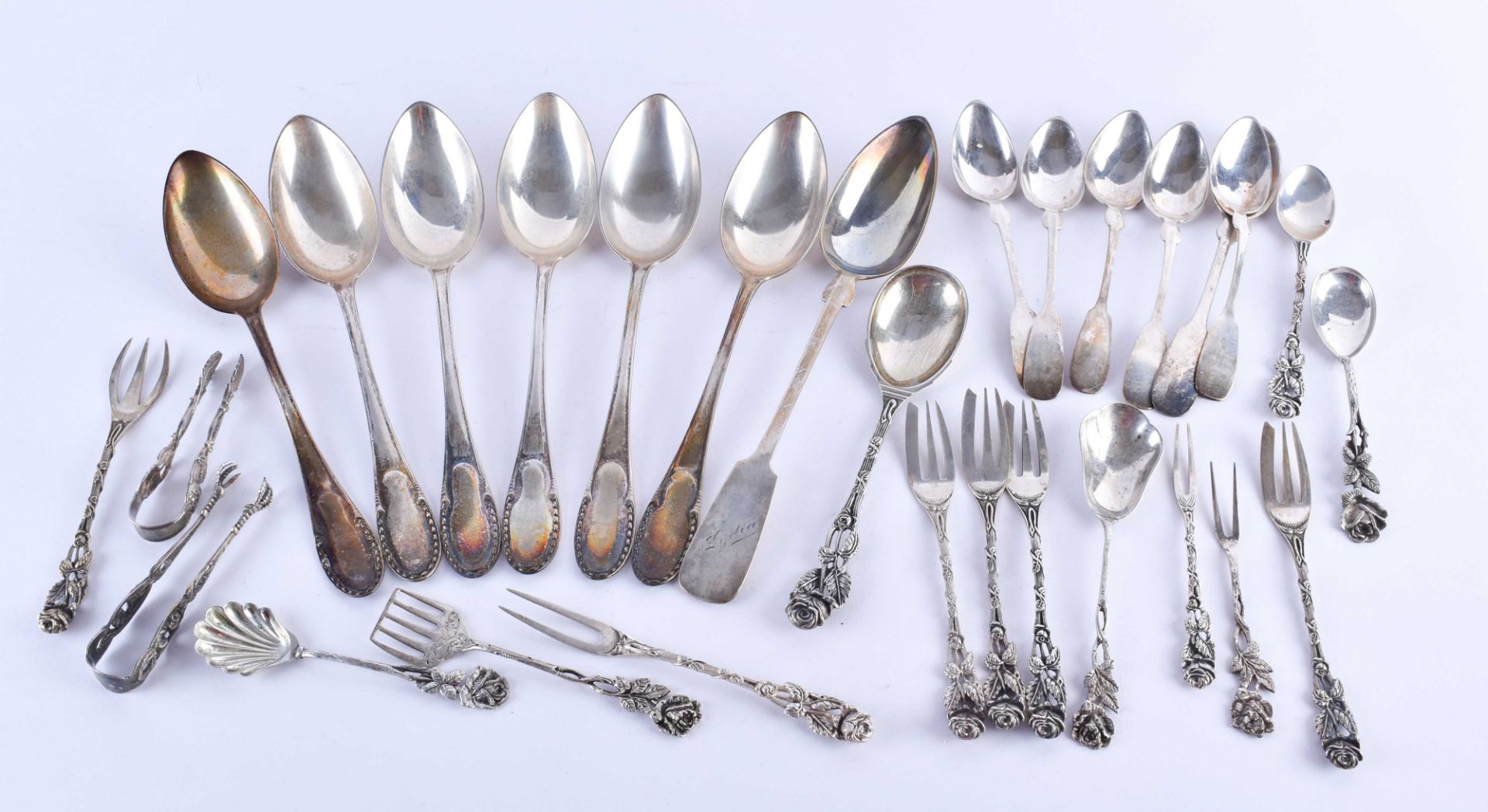 A group of silver cutlery