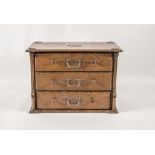 Miniaturkommode / A wooden miniature chest of drawers