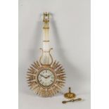 Dekorative Wanduhr 'Pendel mit Sonne' / A decorative pendulum and sun shaped wall clock, ...