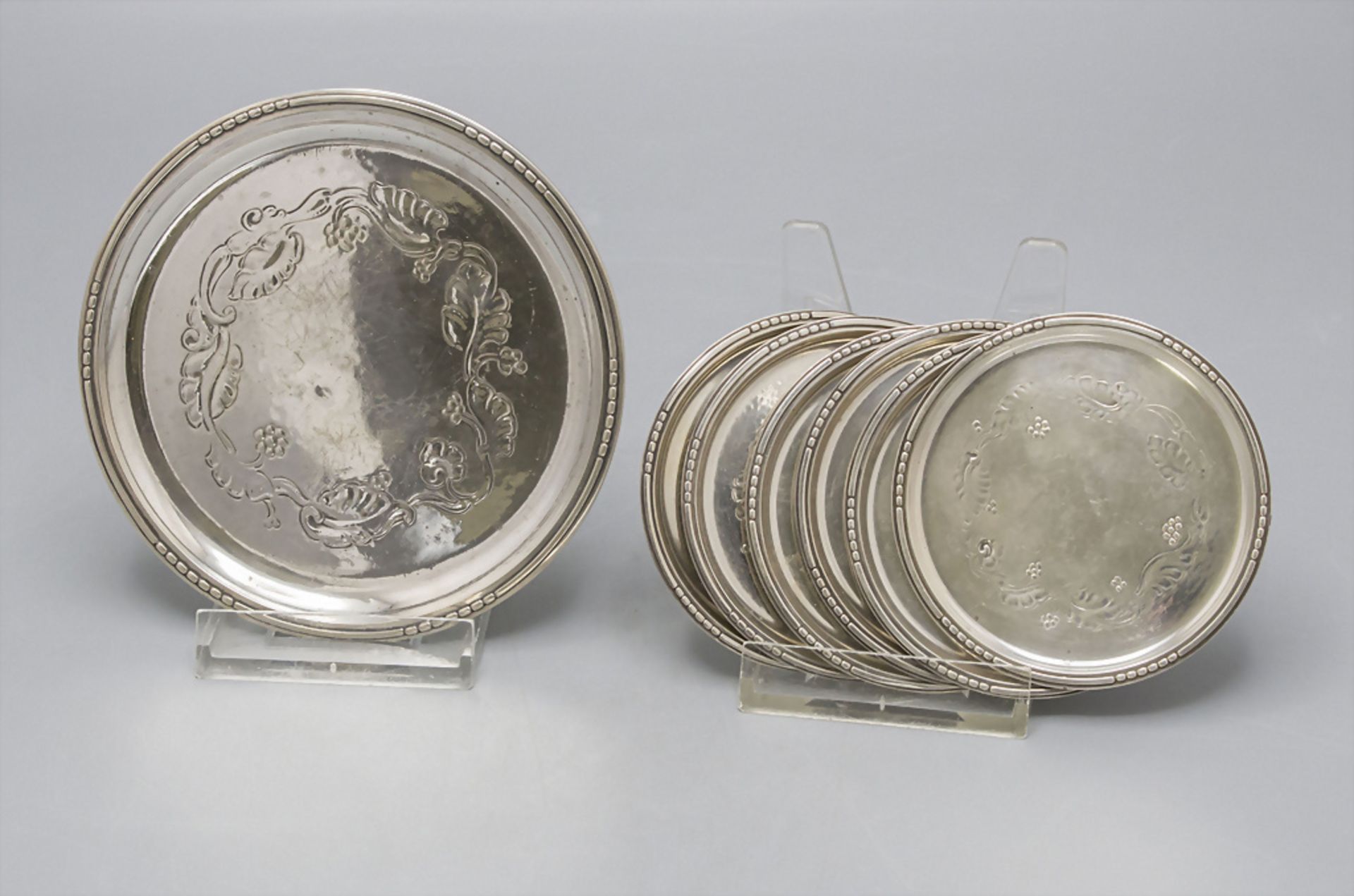 Set mit 7 Untersetzern / A 7 pieces coaster set with leaf and grape pattern, Georg Jensen, ...