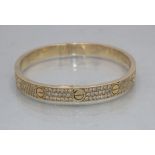 Cartier, Armband mit Diamanten 'Love Bracelet' / An 18 ct. gold bracelet with diamonds