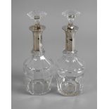Pair of lead crystal decanters with silver mount