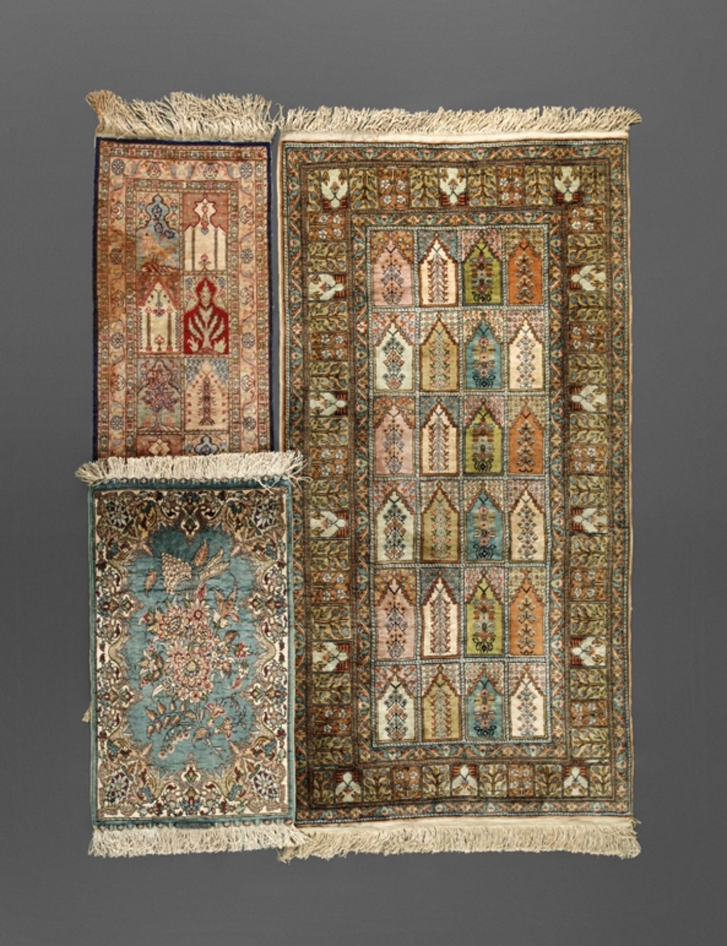 Three small silk carpets