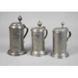 Three cylindrical jugs